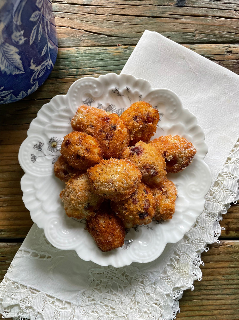 a dish of honey madeleines made with Turmeric Chai honey