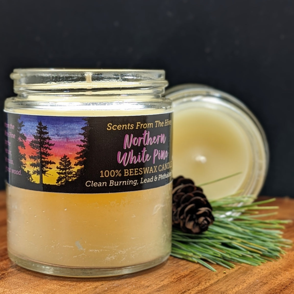 Northern White Pine scented beeswax candle in a 4oz glass jar.