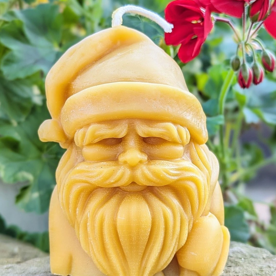 Santas head in a beautiful beeswax candle. 5"tall over 1lb of Beeswax.
