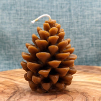 small pine cone molded beeswax candle brown