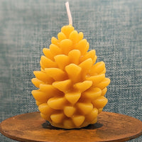 small 100% pine cone beeswax candle natural yellow