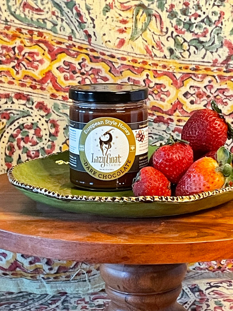 A 12oz jar of Dark Chocolate Creamed Honey.