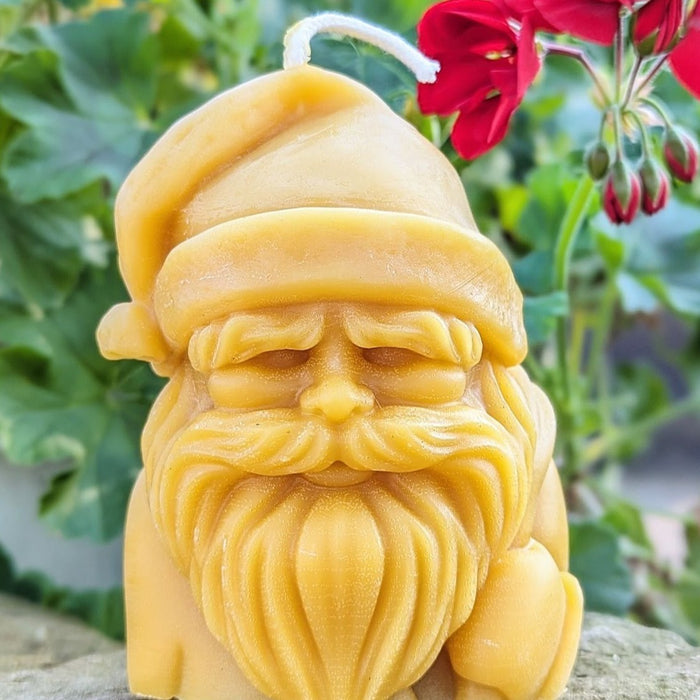  Santas head in a beautiful beeswax candle. 5"tall over 1lb of Beeswax.