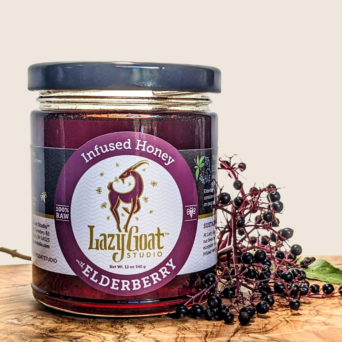 12oz of our delicious Elderberry Infused raw honey in a glass jar.