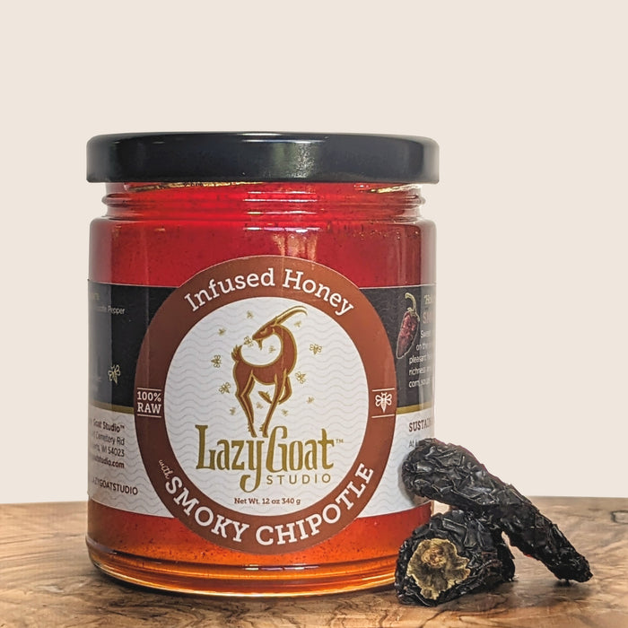 12oz of Smoky Chipotle Infused raw honey in a glass jar.