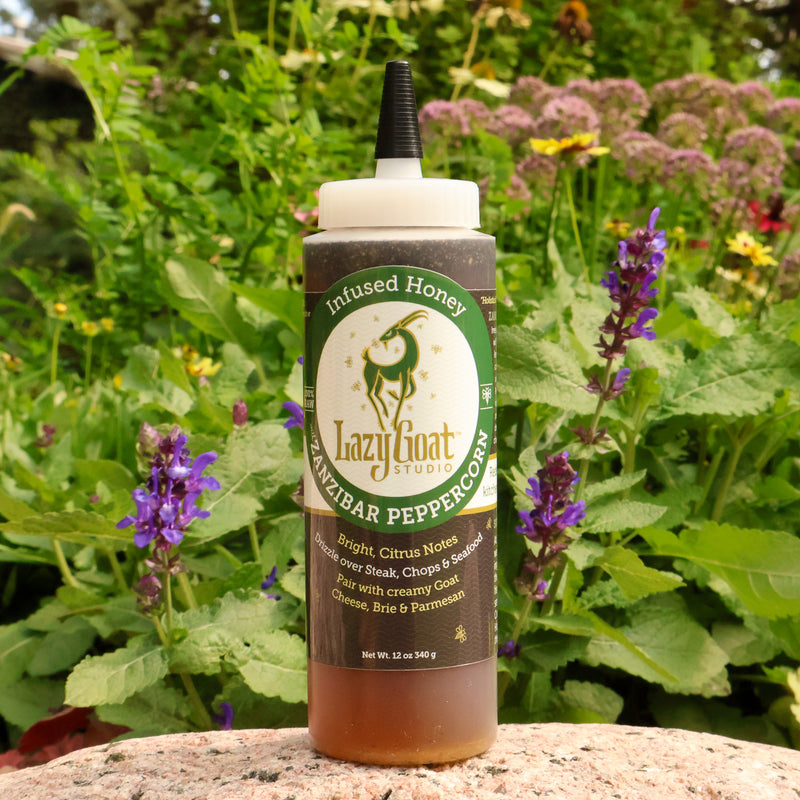 Zanzibar Peppercorn Infused raw honey in a convenient 120z squeeze bottle.